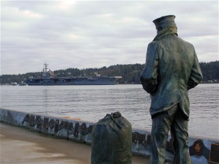 The Lone Sailor Welcomes the USS Ronald Reagan  CVN-76  to Bremerton 10 Jan 2012...Click For HR Photo